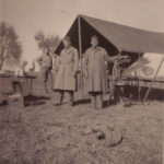 Capt. Lumpkin and two other officers by tent